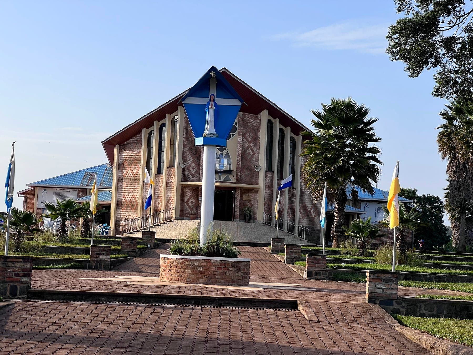 The statue of Our Lady of Kibeho in front of the shrine church